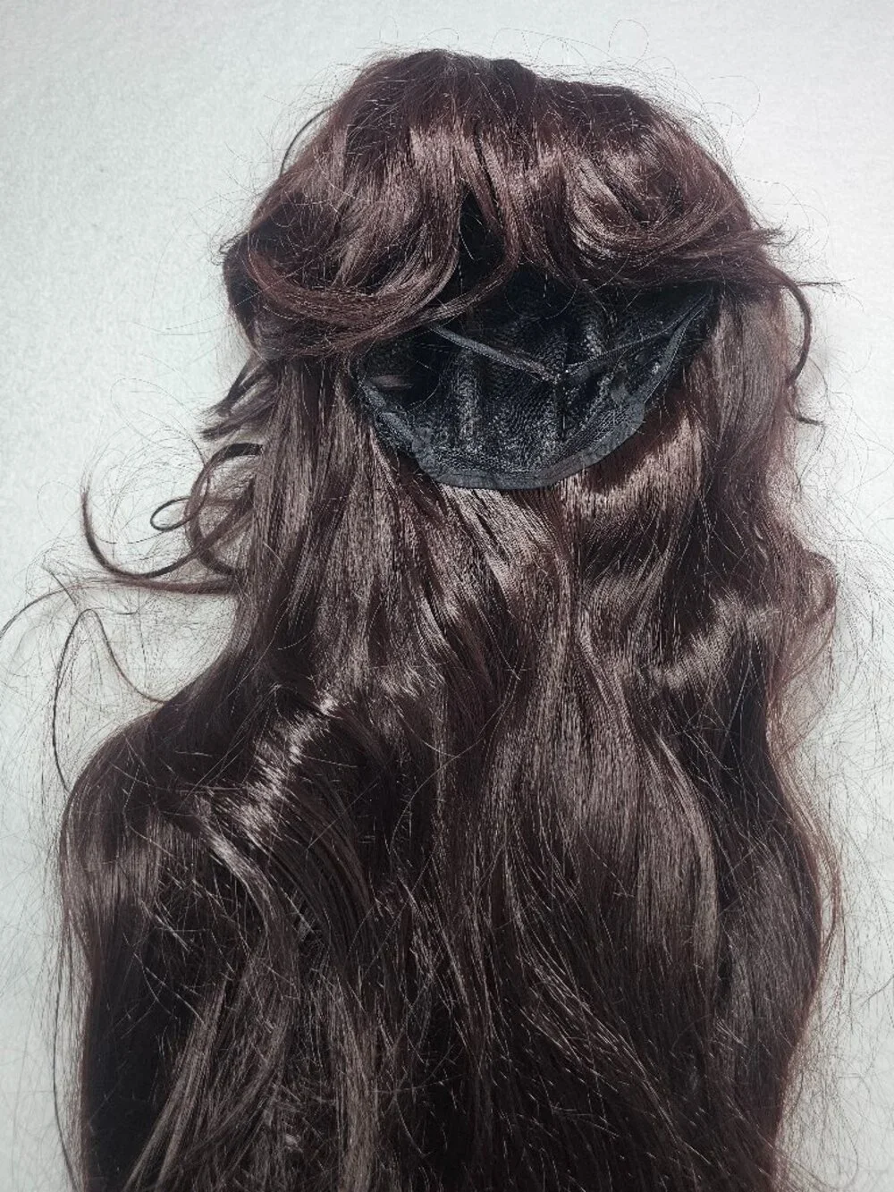 Long, dark brown synthetic hair wig with bangs